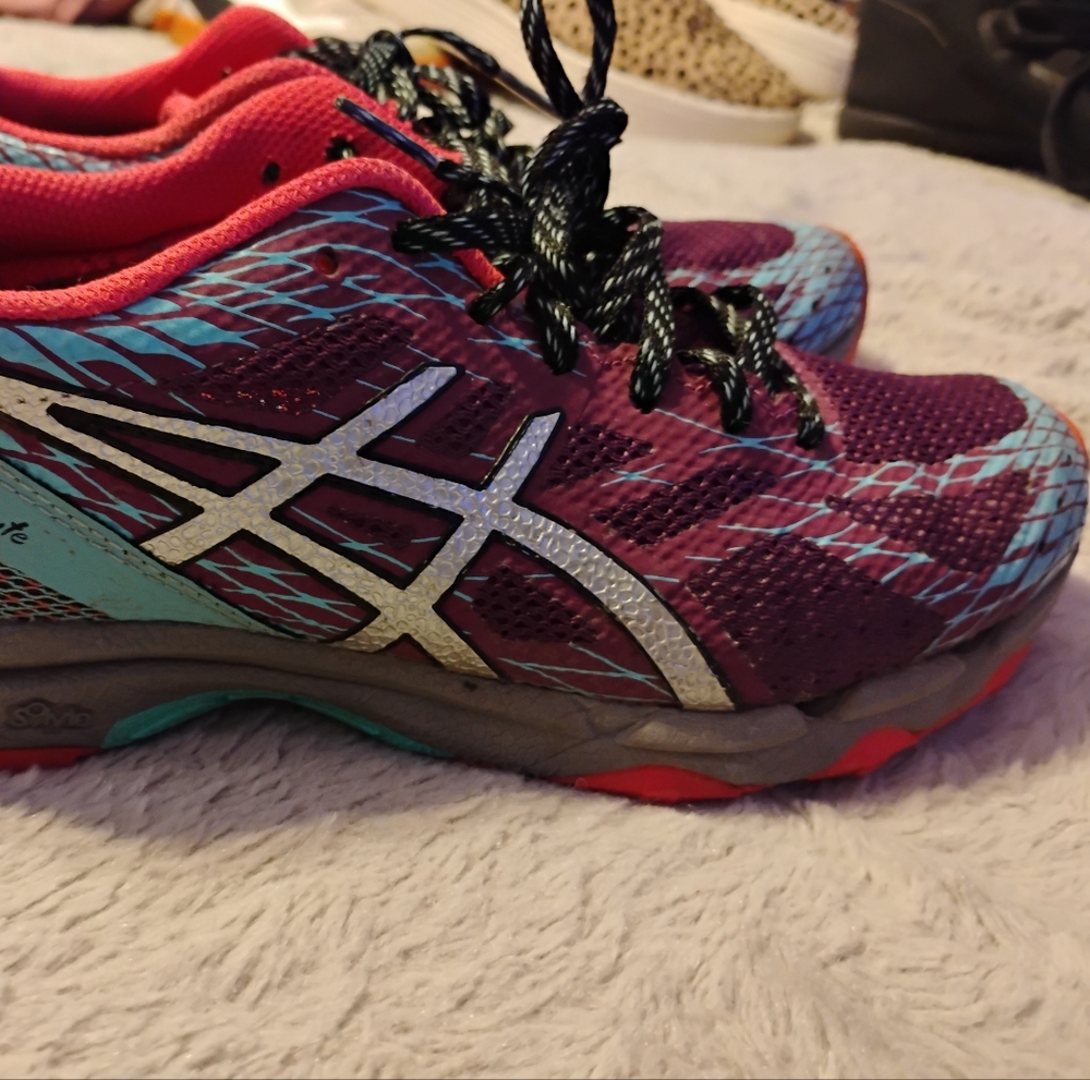 Women's ASICS GEL-FujiLyte trail running shoes.